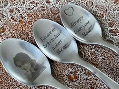 three spoons with the words you are always in your heart and an image of a woman on them