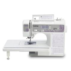 the brother sewing machine is white and has purple flowers on it's front side