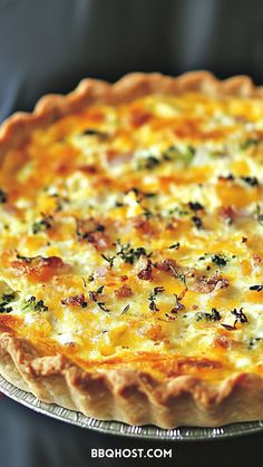 a cheesy quiche with cheese and herbs on top