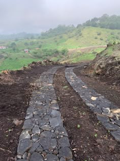 the road is made out of rocks and dirt