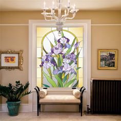 a stained glass window with purple flowers on it