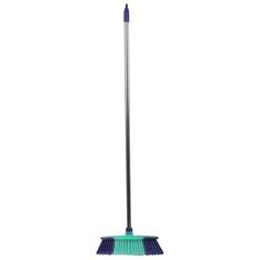 a broom that is on top of a white surface with a blue handle and black bristles