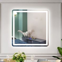 a mirror that is on the wall above a table