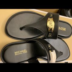 New Leather Michael Kors Sandals Designer Leather Flip Flops For The Beach, Designer Leather Flip Flops For Beach, Luxury Black Leather Flip Flops, Designer Black Toe Post Sandals, Luxury Black Open Toe T-strap Sandals, Designer Black Flip Flops For The Beach, Designer Black Flip Flops For Beach, Designer Black Leather Flip Flops, Luxury Black T-strap Sandals With Single Toe Strap