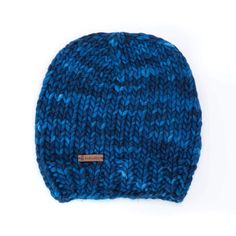 This cozy and incredibly soft classic hand-knit hat can be worn as a stocking cap or slouched back. This reversible hat is made from hand-dyed premium merino wool and features a thick weave and rich texture with beautiful tonal variations. A true winter essential! Knit by hand using luxurious 100% merino 19 micron wool Available in a variety of pastel and vibrant colors to complement your wardrobe Optional detachable pom-pom Made in Santa Cruz, California One size fits most:Width: relaxed 15" fi Blue Knitted Beanie Cap, Winter Blue Hand Knitted Beanie, Blue Handmade Beanie One Size, Blue Knit Beanie Cap, Blue Wool Beanie, Wool Cowl, Stocking Cap, Soft Classic, Felted Slippers