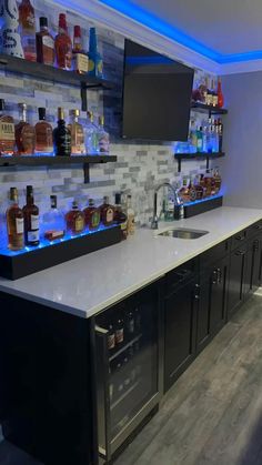 a bar with liquor bottles on the shelves