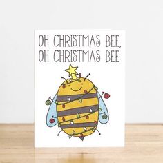 a christmas card with a cartoon bee on it