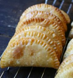 four pastries sitting on top of a cooling rack