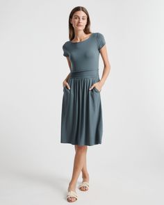 Fitted where you want it, flowy where it feels good. Our Tencel Jersey Ruched Waist Dress is the one-and-done outfit you’ll go to season after season. Eco-cool and all-day comfy, it’s as soft as it is sustainable, and it’s part of our growing knit-dress collection. With hidden side pockets for extra functionality, you’ll definitely say yes to this dress.  | Quince | Women's Tencel Jersey Ruched Waist Dress in Dark Olive, Size Small Ruched Waist Dress, Light Dress, Travel Dress, Quince Dresses, Capped Sleeve Dress, Versatile Dresses, Say Yes, Dress C, Waist Dress