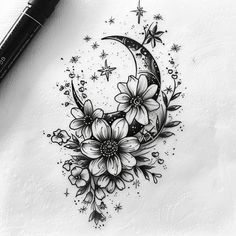 a black and white drawing of a crescent moon with flowers on it's side