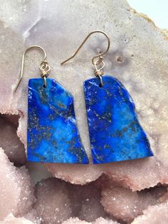 Make a statement with these gorgeous blue lapis dangle earrings. One of a kind and made with all gold filled metals. Gold filled is a metal made to last and just one step down from solid gold. No tarnishing and easy to clean to bring back to its shine!  Gorgeous long lapis lazuli statement earrings! Hang length is 50mm Blue Lapis Lazuli Drop Earrings, Blue Natural Stone Earrings As Gift, Blue Lapis Lazuli Earrings, Lapis Lazuli Dangle Earrings For Pierced Ears, Lapis Lazuli Dangle Earrings With Natural Stones, Handmade Blue Lapis Lazuli Earrings, Blue Lapis Lazuli Jewelry With Ear Wire, Lapis Lazuli Natural Stones Drop Earrings, Blue Lapis Lazuli Earrings For Gift