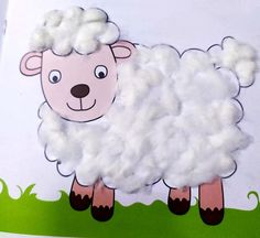 a paper cut out of a sheep on top of grass