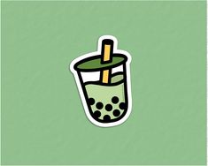 a drink with a straw in it on a green background