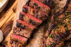 some meat is sitting on a cutting board