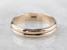 Crafted of polished 14 karat yellow gold, this double-row band features a simple milgrain edge and a timeless style. Unisex and ready to wear or gift! Metal: 14K Yellow Gold Width of Band: 4.1 mm Height off Finger: 1.3 mm Ring Size: 7.50 Marks: "14K" Stamped on the inside band Classic 14k Gold Double Band, Yellow Gold Double Band Wedding Rings, Classic Yellow Gold Bands With Milgrain, Classic Double Band Anniversary Jewelry, Gold Double Band Formal Bands, Classic Yellow Gold Milgrain Bands, Gold Double Band For Formal Occasions, Classic Double Band Jewelry For Anniversary, Classic White Gold Double Band