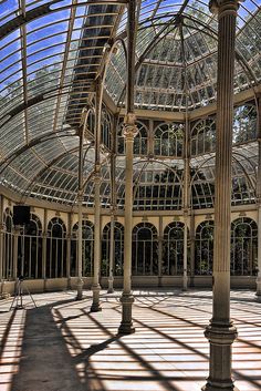 the inside of an old building with many windows and arches on it's sides