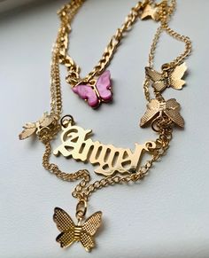 Stunning gold 'Angel' necklace with gold butterflies and a pink butterfly 🦋 💕 Check my shop out for more cute jewellery 😊 Pink Clavicle Chain Charm Necklace For Party, Gold Metal Butterfly Necklace For Party, Trendy Butterfly-shaped Jewelry With Adjustable Chain, Pink Gold-plated Charm Necklaces With Adjustable Chain, Gold Butterfly Chain Jewelry, Metal Butterfly Charm Necklace For Party, Trendy Butterfly Shaped Jewelry With Adjustable Chain, Pink Gold-plated Charm Necklace With Adjustable Chain, Gold Metal Butterfly Necklace