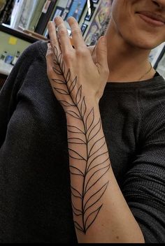 a woman with a tattoo on her arm