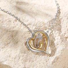 Perfect for mom or mom-to-be, this two-tone fashion necklace is a lovely testament to baby love. In the circle of the heart, two footprints - one silhouette decorated with a small shining stone of an adult and the other in gold tone of a child - are nestled together. So delightful and playful, this sweet image records your milestone moments in your growth accompanied with mom. Treat her with this cute necklace on a special day!  Carat Weight: 0.01 ctStone Size: 1 mmStone Type: Jeulia® StoneNumbe Necklace Online, White Necklace, Cute Necklace, Mom And Baby, Quality Jewelry, Earring Necklace, Watch Design, Baby Love, Diamond White