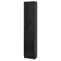 a tall black cabinet with flowers on the front and bottom doors, against a white background