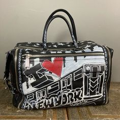 Rebecca Minkoff Luggage Duffle Leather Bag Graffiti Runway Ny Fashion Week 2022 Men's Or Women's This Bag Made Its Debut At Ny Fashion Week For 2022-2023 Spring And Summer! It Is Brand New Never Carried And Is Likely A One Of A Kind, Limited Edition! This Was Created Just For The Show. It Was Hand Painted With All Kinds Of Iconic Nyc References And Lyrics From Frank Sinatra Spelled Out Plus: - The Subway - "I (Heart) New York" - Rebecca's Initials - "The Big Apple" - "Fearless" - Stars As Part O Designer Duffle Bag For Daily Use, Designer Satchel Travel Bag For Errands, Designer Tote Travel Bag For Errands, Designer Tote Duffle Bag For Shopping, Designer Duffle Bag For Shopping, Designer Travel Tote Bag For On-the-go, Designer Top Handle Duffle Bag For Shopping, Designer Leather Duffle Bag For Shopping, Designer Everyday Duffle Bag