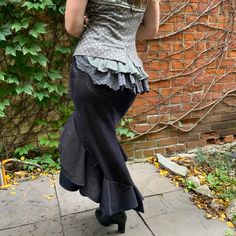 "This gorgeous skirt accentuates a woman's curves.  A dramatic skirt to wow, with great movement for dancing. Two tiered ruffle skirt with variegated hem line. Fit and flare style which is flattering on most body shapes.  Made from a pair of quality stretchy cotton corduroy dress pants.    Featuring 4 functional pockets, 2 on back side and 2 on the hips.  Soft to touch and navy blue with beige undertones.  Size Medium Waist 31\"-32.5\" Hip 39\"-42\" Length:  Front: 20\" Back: 35\" This is a zero Vintage Fitted Asymmetrical Skirt, Gothic Fitted Skirted Bottoms, Fitted Gothic Skirted Bottoms, Vintage Fitted Ruffled Skirt Bottoms, Fitted Vintage Ruffled Skirt Bottoms, Vintage Fitted Bottoms With Ruffled Skirt, Fitted Vintage Bottoms With Ruffles, Fitted Vintage Bottoms With Attached Cancan, Fitted Can-can Skirt