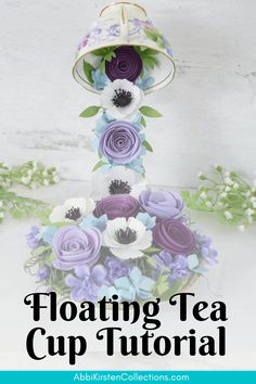 a tea cup with flowers on it and the words floating tea cup floral arrangement above it