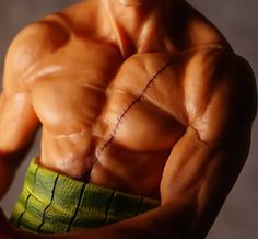 a close up of a man's torso and muscles