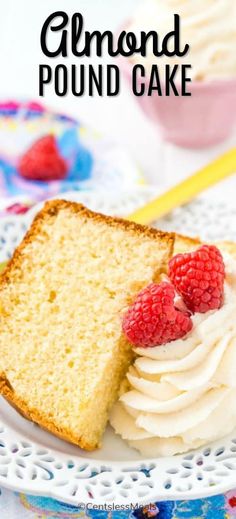 a piece of pound cake on a plate with raspberries and cream frosting