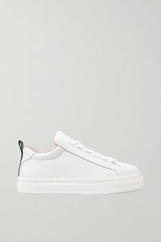 Chloé is just as good at designing sneakers as it is floaty dresses and 'It' bags. This 'Lauren' pair has been made in Spain from smooth white leather detailed with signature scalloping. Showcase the logo lettered heel tabs with cropped jeans. It Bags, Chloe Shoulder Bag, Chic Sneakers, Floaty Dress, Chloe Shoes, Lace Sneakers, Leather Trainers, Latest Sneakers, Girls Sneakers