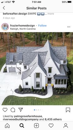 an aerial view of a white house with gray shingles