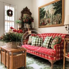 a living room filled with lots of furniture and flowers on top of a coffee table