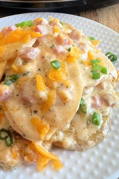 a close up of a plate of food with broccoli and cheese on it