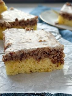 two pieces of cake sitting on top of white paper