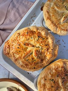 three different types of pies on a tray