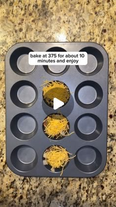 an empty muffin pan filled with cupcakes and shredded yellow stuff in it