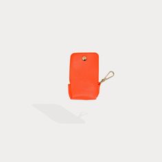 A compact carrier for your AirPods, this pebble leather clip-on pouch with microfiber interior attaches to your Bandolier Phone case, keys or everyday bag to ensure your AirPods are always within reach. Functional Rectangular Pouch With Interior Key Chain Holder, Functional Rectangular Coin Purse, Versatile Everyday Bag With Key Leash, Modern Leather Phone Accessories For Everyday Use, Modern Coin Purse With Key Clip For Travel, Modern Coin Purse With Key Clip, Modern Travel Coin Purse With Key Clip, Modern Leather Phone Accessories, Rectangular Shape, Modern Leather Rectangular Phone Accessories