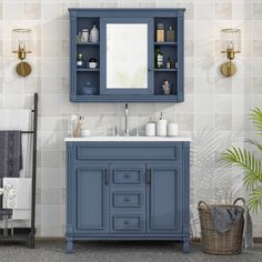 a bathroom with blue cabinets and a white sink