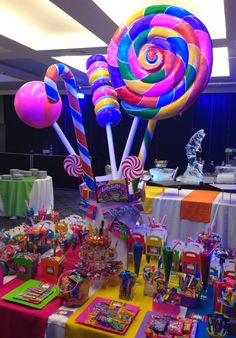 an assortment of candy and lollipops on display at a party