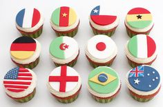 cupcakes decorated in the colors of different countries