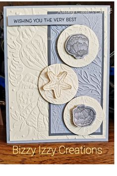 a card with two seashells on it and the words wishing you the very best