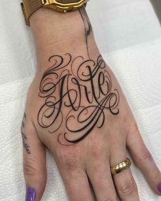 a woman's hand with a tattoo on it and the word hope written in cursive font