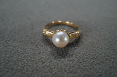 I am offering you this antique vintage 14 K yellow gold amazing wedding band stacker design ring. This features a round shaped bezel set genuine cultured pearl stone.  This features a wonderful domed raised relief detailed single stone stone design setting!  This measures app. 3/4 inch, by app. 1/4 inch. This is coming to you fresh out of an estate from here in Upstate New York.  It weighs app. 3 grams.  This is currently a size  6, though I am sure this could be sized up or down.  ** Please review all of my pictures, as they are an important part of my listing / description . Buyer pays all shipping and handling fees. Vintage Rings With Classic Design, Classic Round Pearl Ring For Anniversary, Vintage Gold Diamond Ring With Bezel Setting, Classic Round Pearl Ring Stamped 14k, Classic 14k Stamped Pearl Ring, Formal Pearl Ring With Bezel Setting, Vintage Gold Jewelry With Round Stone, Antique 14k Stamped Pearl Wedding Ring, Antique 14k Stamped Pearl Ring For Wedding