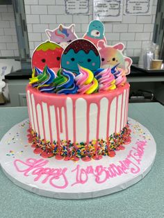 a birthday cake decorated with colorful icing and decorations