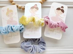 three scrunffle hair ties with thank you tags attached to them