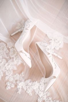 wedding shoes and veil laying on the floor