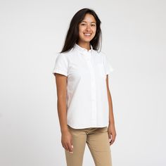 The White Oxford shirt is one of the most timeless and versatile pieces in the service industry, able to be dressed up with a blazer, or down with jeans and sneakers. The updated and upgraded version of our Service Oxford features an equally durable but much softer 50/50 cotton poly blend, as well as cleaner stitching, a crisper collar, and an improved fit. Features: Button-down collar, clean finished seams Material: 50% Cotton, 50% Polyester, 4oz White Oxford Cloth Fit: Model is 6'0"/170 lbs, w Versatile Relaxed Fit Shirt For Business Casual, Classic Shirt With Welt Pockets For Everyday, Casual Tops With Welt Pockets For Daywear, Casual Business Tops With Welt Pockets, White Top With Welt Pockets For Business Casual, Casual Tops With Welt Pockets For Business Casual, White Oxford Shirt, White Oxford, 170 Lbs