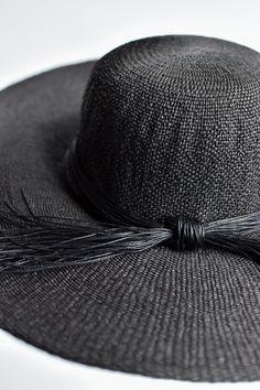 The Big Hat is an over-sized floppy style for relaxing on the beach or spending time in the garden. This black straw hat is finished off with a black cording band to keep it looking modern while protecting your face from the sun. Content:- Paper Straw- Imported Size:- One Size Fits All, Adjustable- Crown: 4"- Brim: 5.5" Luxury Black Beach Hat, Black Panama Hat For Summer Travel, Black Summer Panama Hat For Beach, Summer Black Panama Hat For Beach, Summer Beach Panama Hat In Black, Black Toquilla Straw Sun Hat For Spring, Black Curved Brim Summer Sun Hat, Black Straw Sun Hat For Vacation, Black Straw Sun Hat For Spring