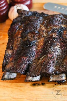 a large piece of meat sitting on top of a wooden cutting board