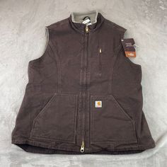 Carhartt Vest Women Plus 1x Brown Duck Canvas Sherpa Lined Full Zip Pockets Nwt 12-Ounce, 100% Cotton Sandstone Duck Sherpa Lining Zipper-Secured Chest Map Pocket Double Front Zipper Two Lower-Front Pockets One Interior Pocket Drop-Tail Adds Coverage Triple-Stitched Main Seams Please View Pictures For Measurements. Please View And Zoom In On All Of The Pictures As They Are Part Of The Description. (See Measurements To Assure Proper Fit) If You Need A Different Measurements Please Message Us And Carhartt Womens Vest, Carhartt Women Vest, Canvas Vest, Carhartt Vest, Flannel Vest, Carhartt Jackets, Thanks For The Support, Carhartt Womens, Carhartt Women